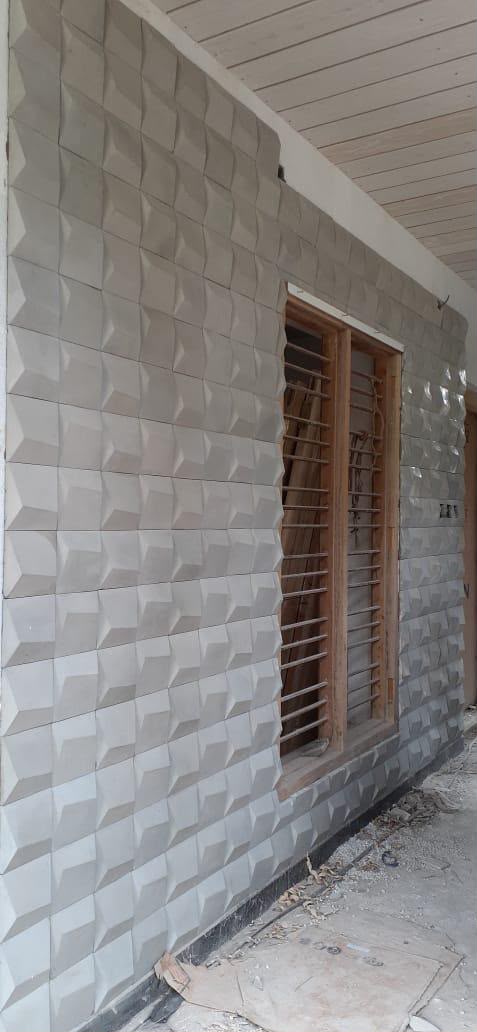 Finished veranda wall clad in checkered 3D panels